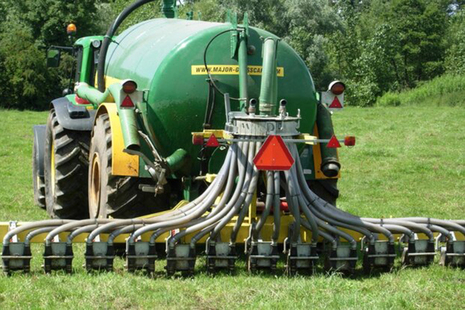 Tractor pulling farm equipment